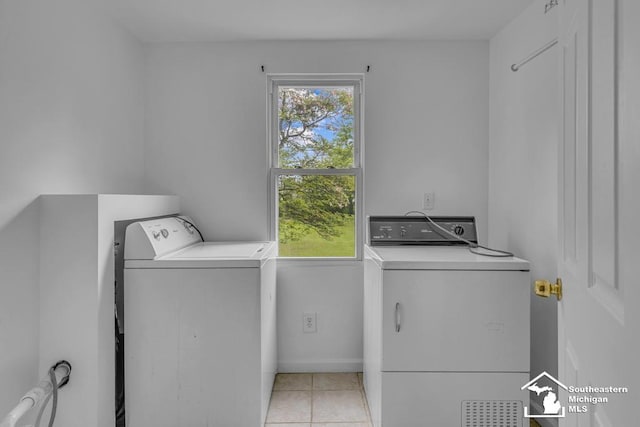 7316 Summerfield Rd, Lambertville, MI 48144 - clothes washing area with separate washer and dryer and light tile patterned floors