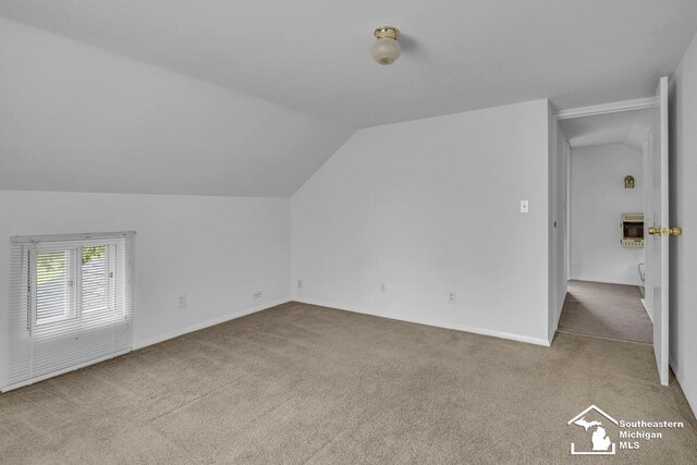 7316 Summerfield Rd, Lambertville, MI 48144 - additional living space featuring lofted ceiling, carpet floors, heating unit, and baseboards