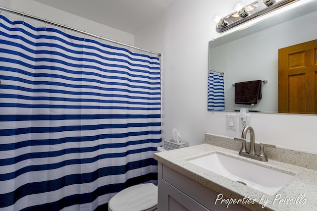 315 Hayes St NW, Comstock Park, MI 49321 - full bath featuring toilet, vanity, and a shower with shower curtain
