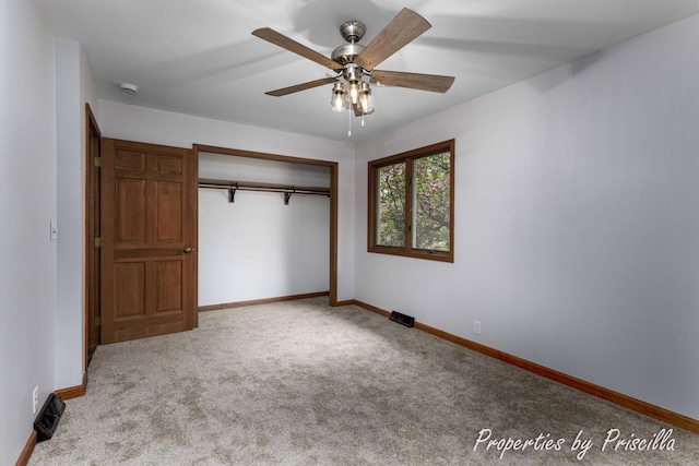 315 Hayes St NW, Comstock Park, MI 49321 - unfurnished bedroom featuring carpet, baseboards, a closet, and a ceiling fan