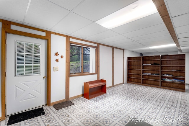 315 Hayes St NW, Comstock Park, MI 49321 - basement featuring a drop ceiling, light floors, and baseboards