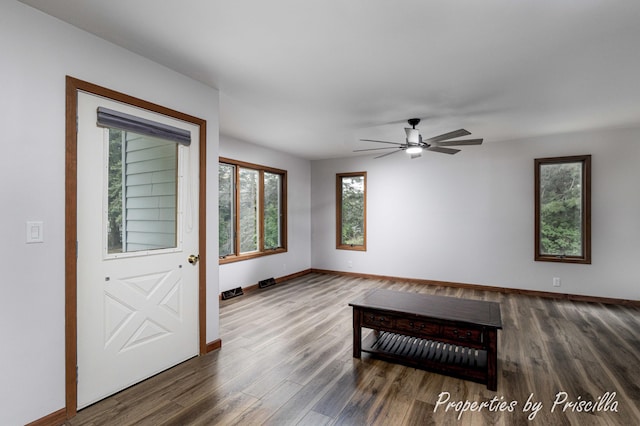 315 Hayes St NW, Comstock Park, MI 49321 - unfurnished room featuring baseboards, dark wood finished floors, and ceiling fan