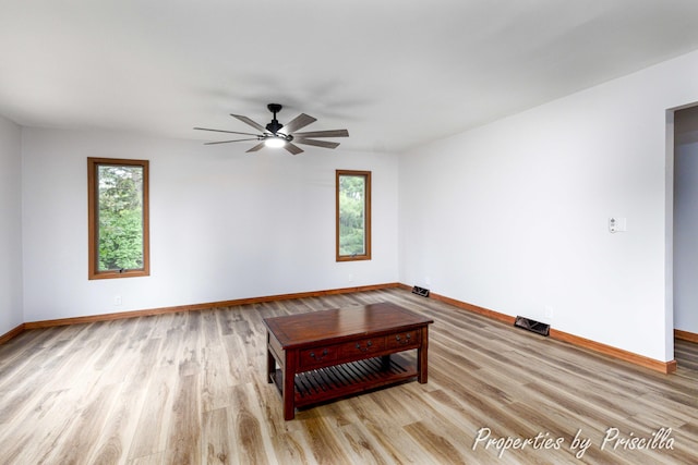 315 Hayes St NW, Comstock Park, MI 49321 - living area featuring wood finished floors, baseboards, and ceiling fan