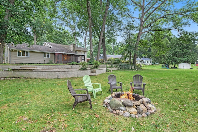 1514 Ferndale Blvd, Niles, MI 49120 - view of grassy yard featuring a fire pit and a sunroom