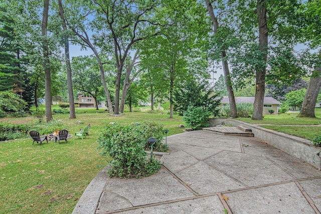 1514 Ferndale Blvd, Niles, MI 49120 - view of green lawn with a fire pit and view of wooded area