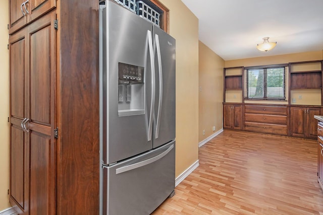 1514 Ferndale Blvd, Niles, MI 49120 - kitchen featuring stainless steel refrigerator with ice dispenser, light wood-style flooring, baseboards, open shelves, and brown cabinets