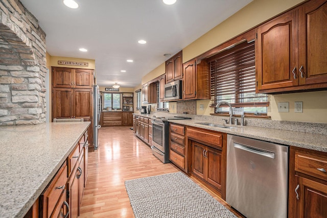 1514 Ferndale Blvd, Niles, MI 49120 - kitchen with stainless steel appliances, a sink, recessed lighting, light wood-style flooring, and light stone counters