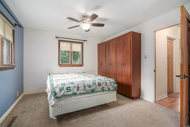 1514 Ferndale Blvd, Niles, MI 49120 - bedroom with light colored carpet, baseboards, a closet, and a ceiling fan