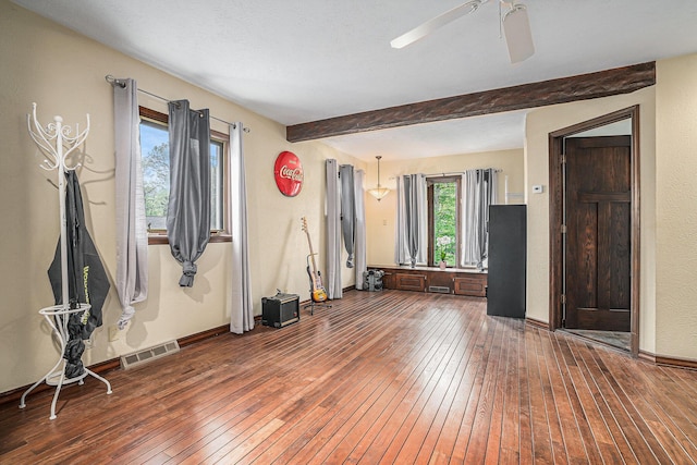 1514 Ferndale Blvd, Niles, MI 49120 - empty room featuring dark wood finished floors, beamed ceiling, a ceiling fan, and baseboards