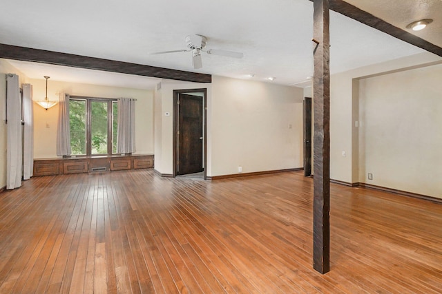 1514 Ferndale Blvd, Niles, MI 49120 - unfurnished living room with wood-type flooring, ceiling fan, and baseboards
