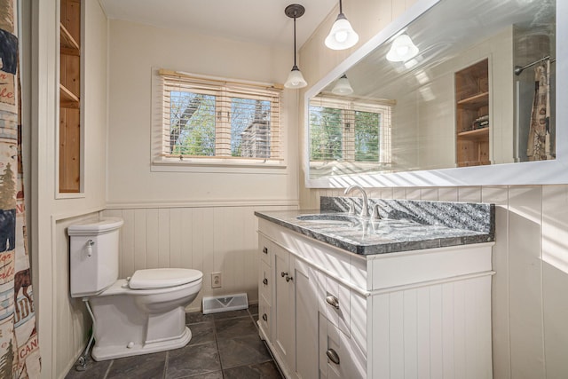 1514 Ferndale Blvd, Niles, MI 49120 - full bathroom featuring a wainscoted wall, vanity, and toilet