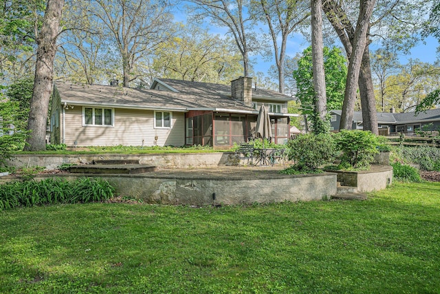 1514 Ferndale Blvd, Niles, MI 49120 - back of house with a sunroom, a yard, and a chimney