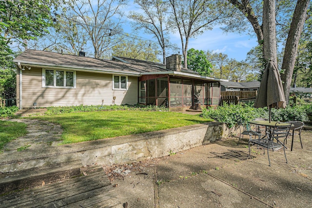 1514 Ferndale Blvd, Niles, MI 49120 - back of house featuring a sunroom, a chimney, central air condition unit, and a patio area
