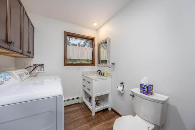 2220 Grass Lake Ave, Lake, MI 48632 - washroom featuring independent washer and dryer, a baseboard heating unit, dark wood-style floors, and baseboards