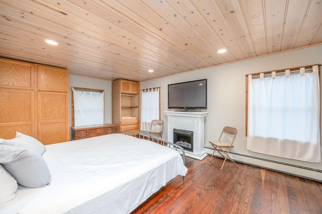 2220 Grass Lake Ave, Lake, MI 48632 - bedroom with baseboard heating, recessed lighting, wood ceiling, a fireplace with raised hearth, and dark wood-style floors