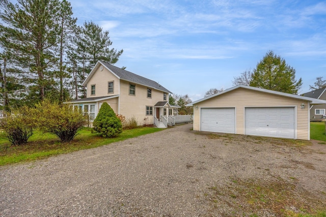 2220 Grass Lake Ave, Lake, MI 48632 - view of property exterior featuring a garage and an outbuilding