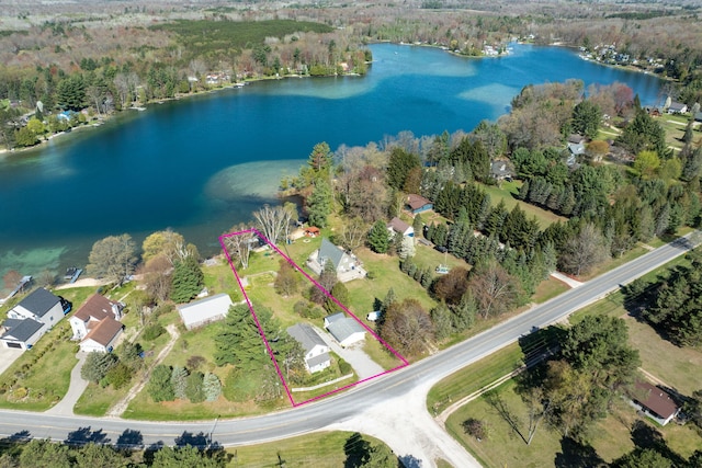 2220 Grass Lake Ave, Lake, MI 48632 - aerial view of property and surrounding area featuring a large body of water, property parcel outlined, and a heavily wooded area