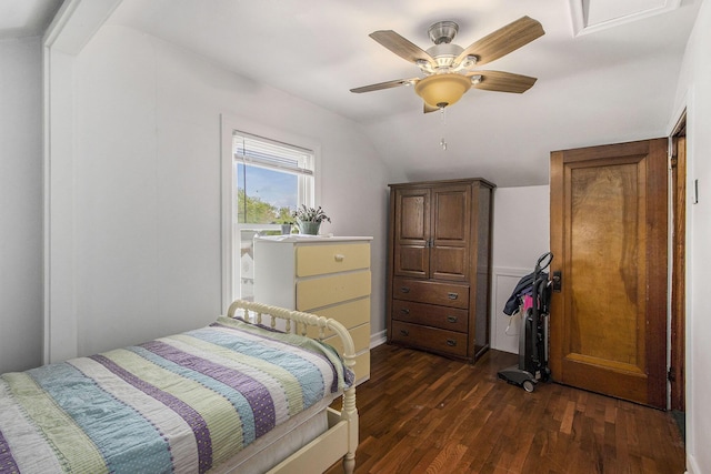 bedroom with lofted ceiling, dark wood-style flooring, and ceiling fan