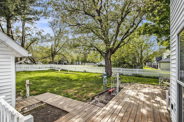 wooden terrace with view of wooded area