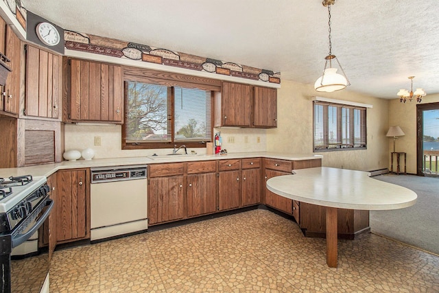 929 S Washington Ave, Ludington, MI 49431 - kitchen featuring white dishwasher, a sink, a textured ceiling, a peninsula, and light countertops
