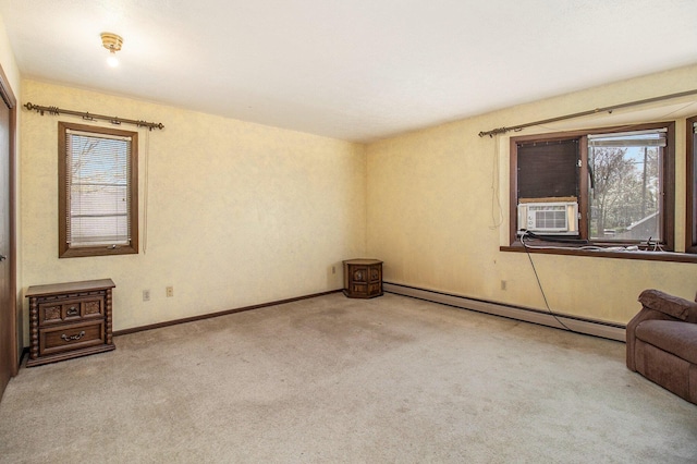 929 S Washington Ave, Ludington, MI 49431 - unfurnished room featuring a baseboard radiator, healthy amount of natural light, carpet floors, and baseboards