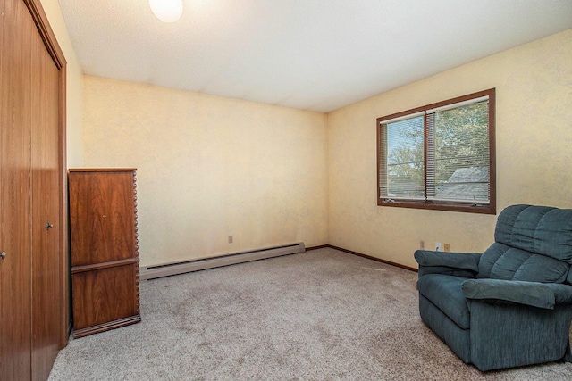 929 S Washington Ave, Ludington, MI 49431 - unfurnished room featuring a baseboard heating unit, carpet flooring, and baseboards