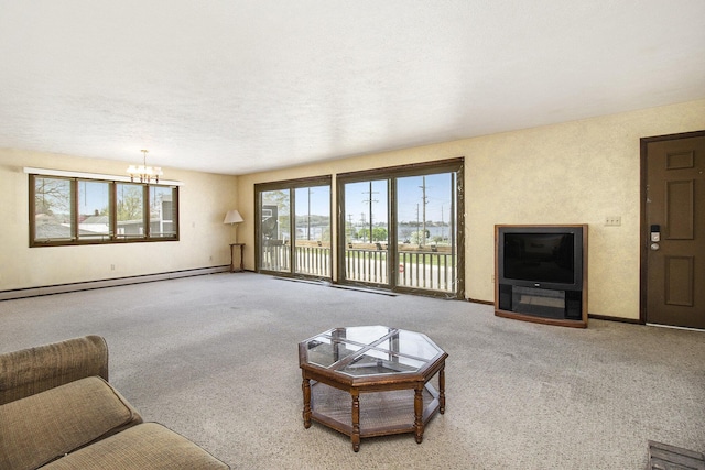 929 S Washington Ave, Ludington, MI 49431 - living room with a baseboard heating unit, a chandelier, carpet floors, and baseboards