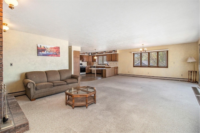 929 S Washington Ave, Ludington, MI 49431 - living room with a baseboard heating unit, a chandelier, and light carpet