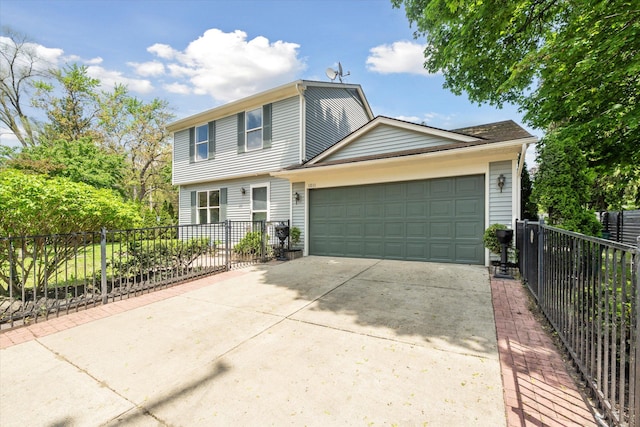 view of front of house with concrete driveway, an attached garage, and fence