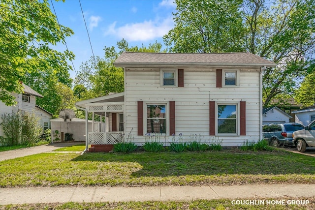 view of front of home featuring a front lawn and a porch