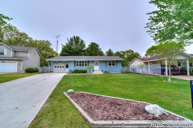 1572 Cornell Rd, Muskegon, MI 49441 - ranch-style home featuring concrete driveway and an attached garage
