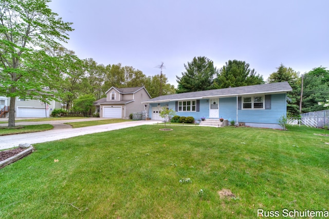 1572 Cornell Rd, Muskegon, MI 49441 - single story home with a front yard, concrete driveway, and an attached garage