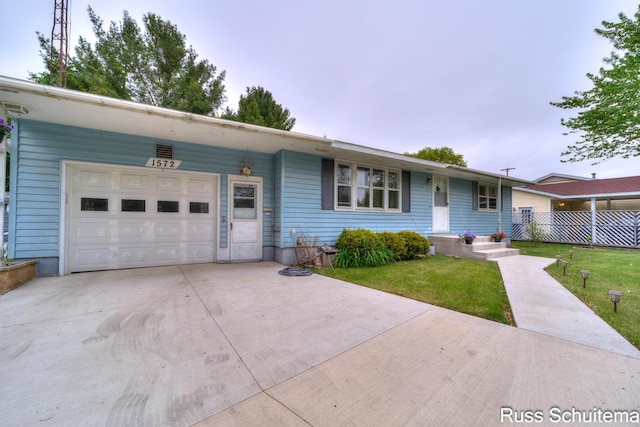 1572 Cornell Rd, Muskegon, MI 49441 - ranch-style house with an attached garage, driveway, and a front yard