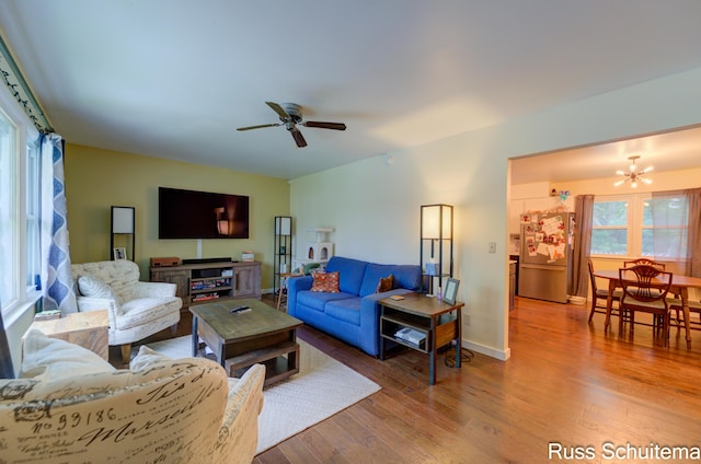 1572 Cornell Rd, Muskegon, MI 49441 - living room featuring healthy amount of natural light, ceiling fan, wood finished floors, and a chandelier
