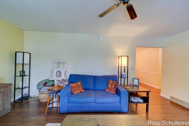 1572 Cornell Rd, Muskegon, MI 49441 - living room featuring a ceiling fan, wood finished floors, and baseboards
