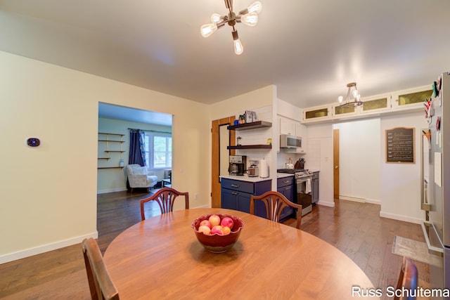 1572 Cornell Rd, Muskegon, MI 49441 - dining room with a chandelier, dark wood-type flooring, and baseboards