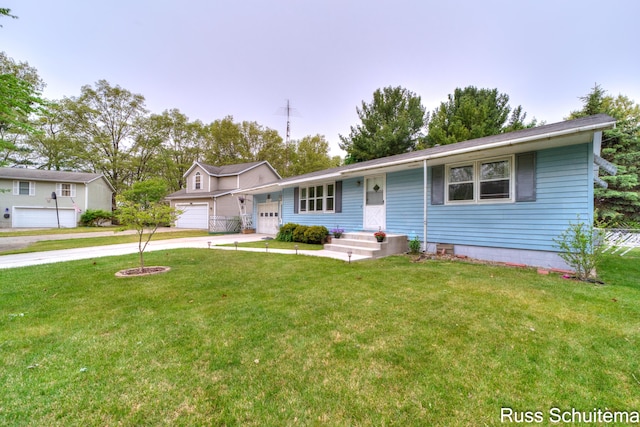 1572 Cornell Rd, Muskegon, MI 49441 - single story home with a front lawn, concrete driveway, and an attached garage
