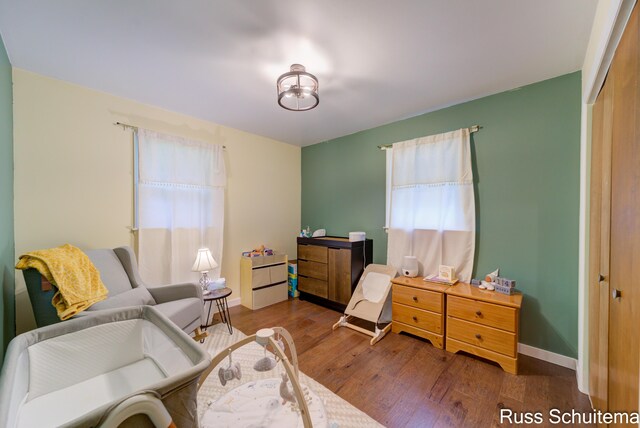 1572 Cornell Rd, Muskegon, MI 49441 - bedroom featuring wood finished floors, a closet, and baseboards