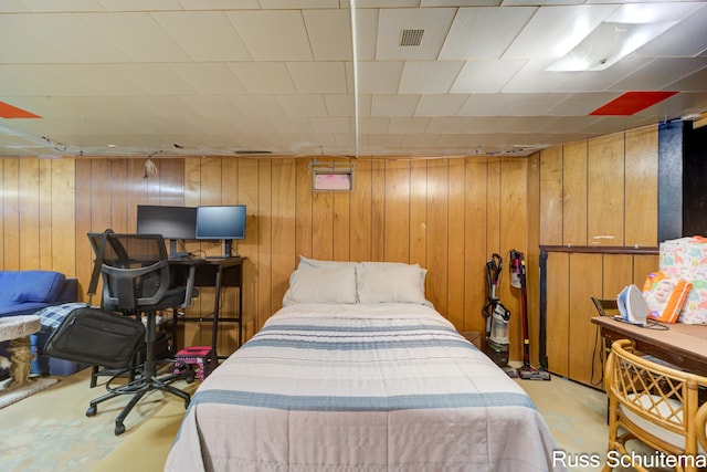 1572 Cornell Rd, Muskegon, MI 49441 - bedroom with wood walls and concrete flooring