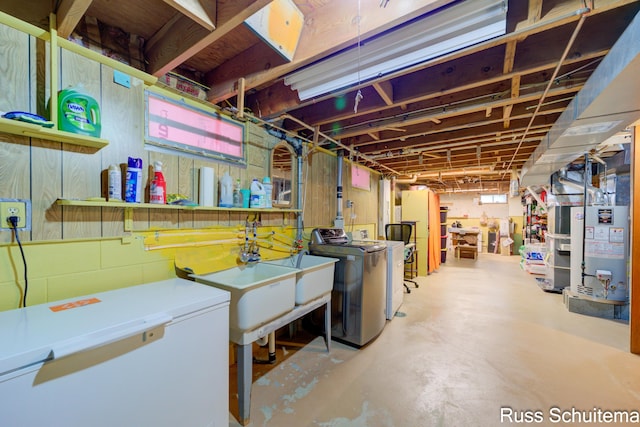 1572 Cornell Rd, Muskegon, MI 49441 - unfinished basement with refrigerator, separate washer and dryer, and gas water heater