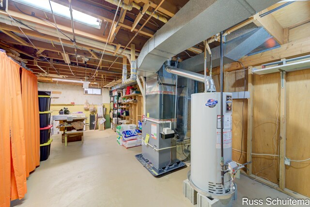 1572 Cornell Rd, Muskegon, MI 49441 - unfinished below grade area featuring gas water heater and heating unit