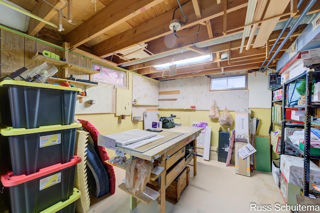 1572 Cornell Rd, Muskegon, MI 49441 - below grade area with a workshop area and concrete block wall