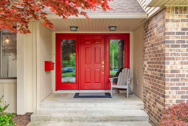 836 Boutell Dr, Grand Blanc, MI 48439 - entrance to property featuring roof with shingles and board and batten siding