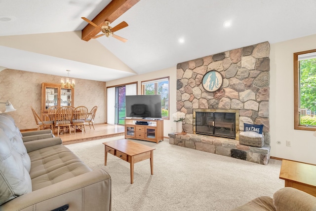 836 Boutell Dr, Grand Blanc, MI 48439 - living area with a chandelier, a fireplace, a ceiling fan, baseboards, and carpet flooring