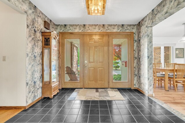 836 Boutell Dr, Grand Blanc, MI 48439 - foyer entrance featuring healthy amount of natural light, baseboards, and wallpapered walls