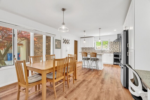 836 Boutell Dr, Grand Blanc, MI 48439 - dining space with light wood-type flooring and recessed lighting
