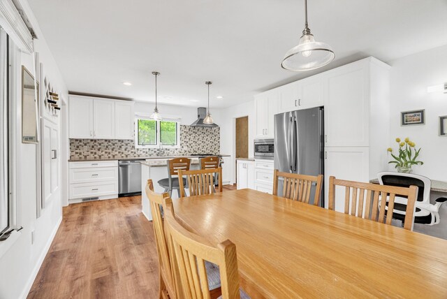 836 Boutell Dr, Grand Blanc, MI 48439 - dining space featuring light wood finished floors and recessed lighting