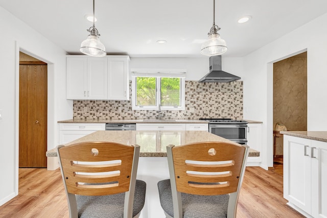 836 Boutell Dr, Grand Blanc, MI 48439 - kitchen featuring wall chimney exhaust hood, appliances with stainless steel finishes, tasteful backsplash, a sink, and light stone countertops