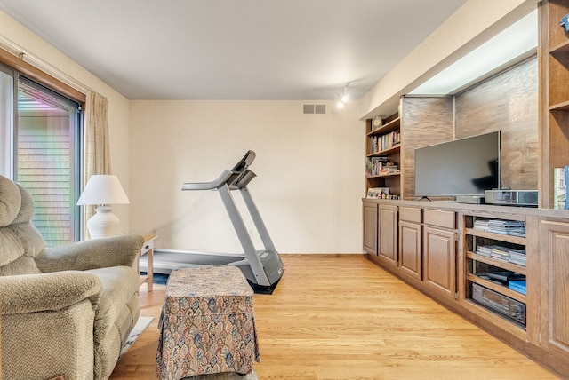 836 Boutell Dr, Grand Blanc, MI 48439 - living area with light wood-style flooring and baseboards