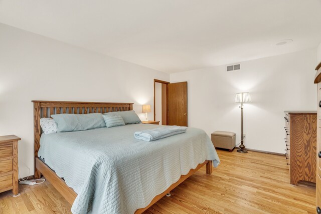 836 Boutell Dr, Grand Blanc, MI 48439 - bedroom featuring light wood-type flooring and baseboards